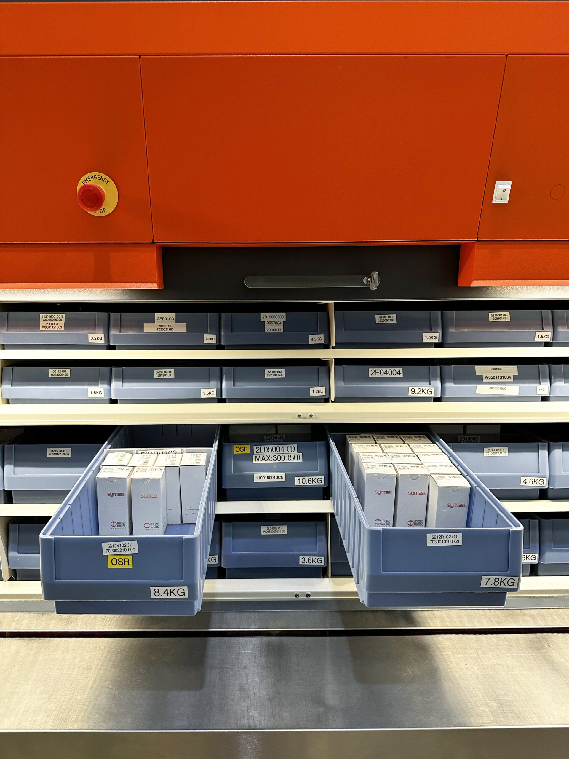 Industore Case Study Image - Branded Orange and black Rotomat, with Containers.