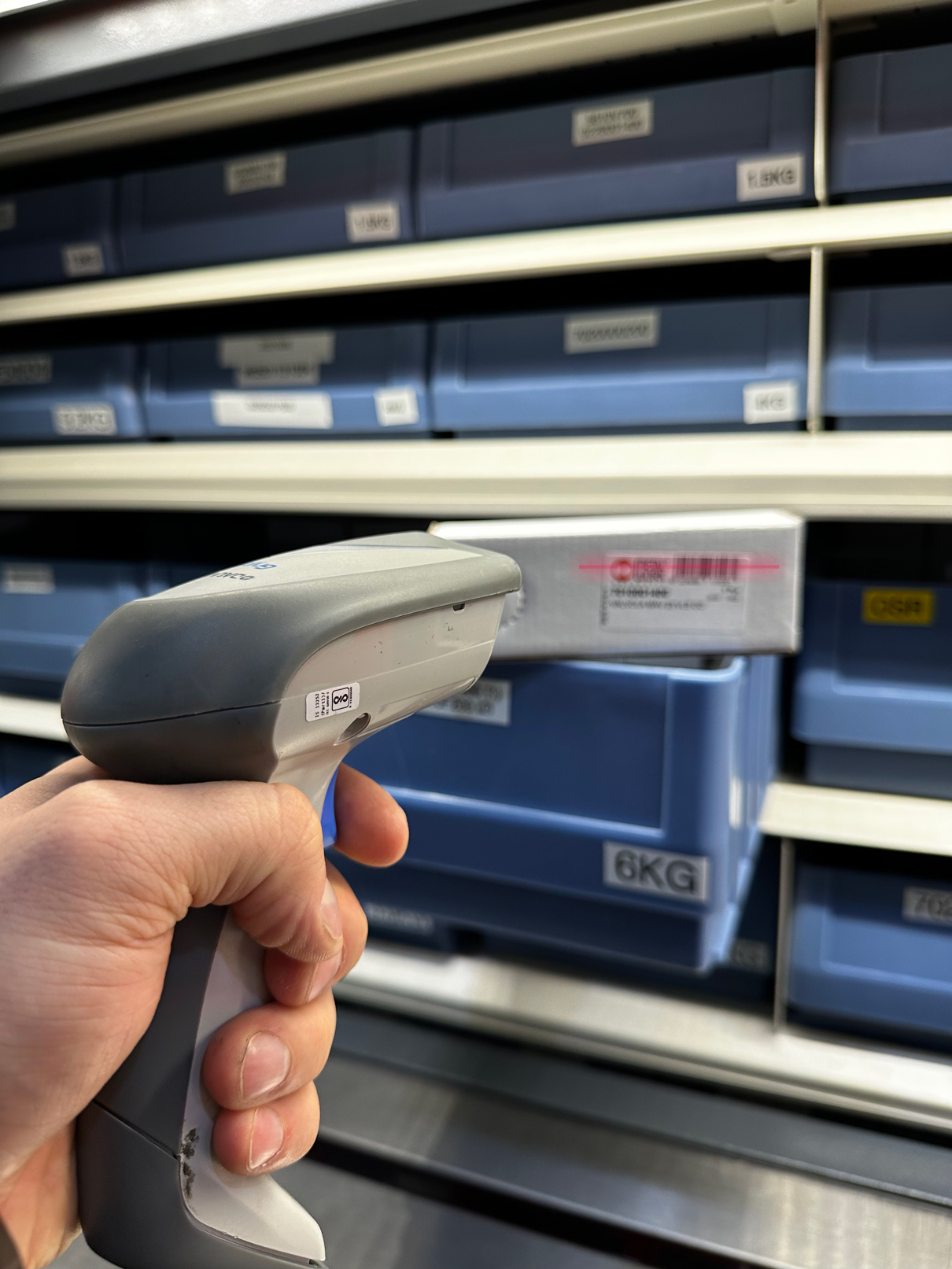 Industore Case Study Image - Branded Orange and black Rotomat, scanning inventory